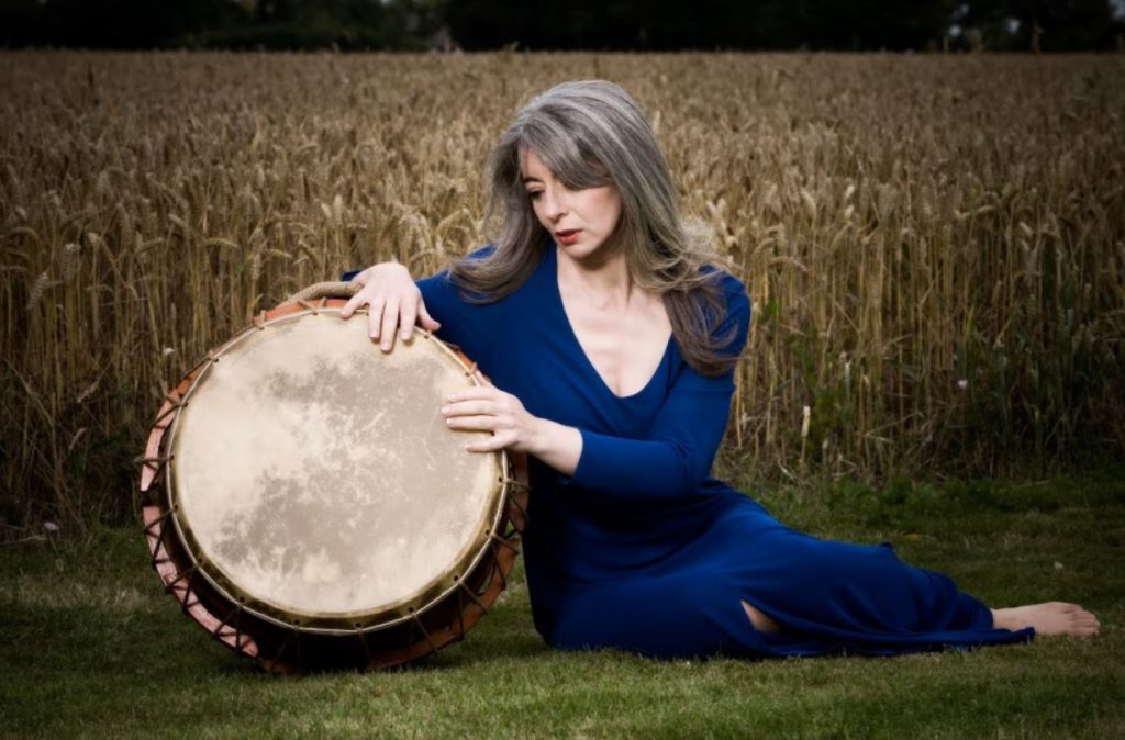 Dame Evelyn Glennie playing a drum outside