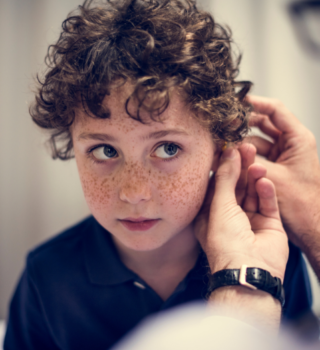 Child getting hearing aid fitted