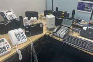 A selection of telecommunication devices on a table ready for testing