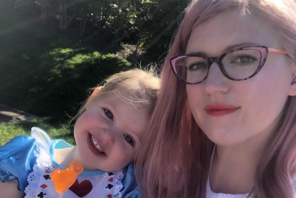 Laura and a little girl smiling