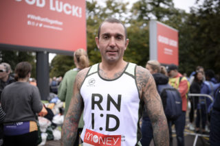 An RNID runner at a running event