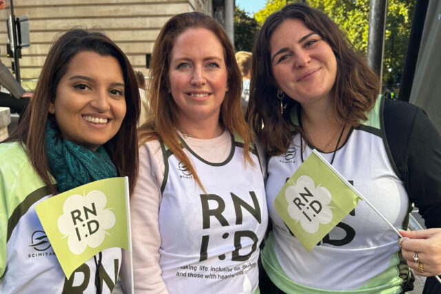 Three women in RNID running vests