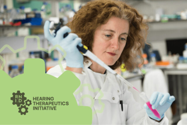 A woman in a laboratory wearing a white lab coat and putting liquid into a test tube. A graphic with the RNID logo inside a cog and the words "Hearing Therapeutics Initiative" are overlaid.