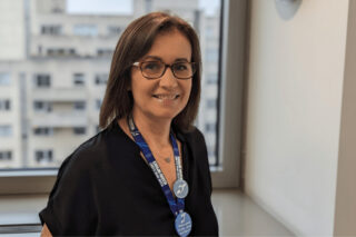 A woman smiling in their office