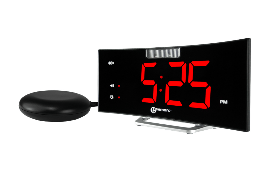 A black curved clock with red digital numbers showing the time: 5:25 PM. Next to it is a black curved plastic item.