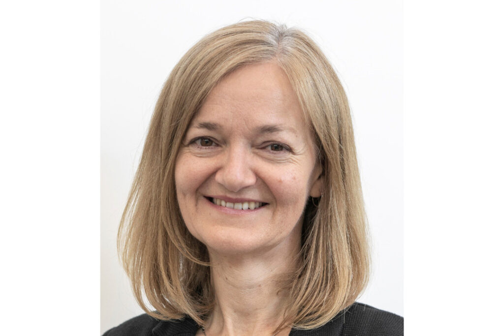 Researcher Professor Jane Sowden has shoulder length blonde hair and smiles.