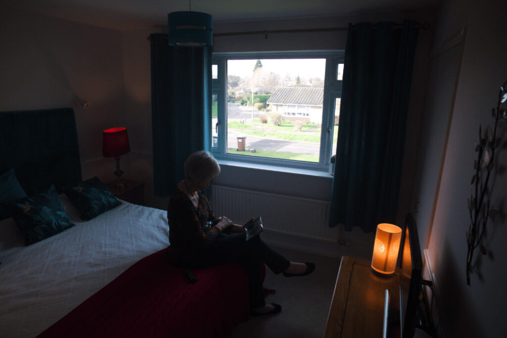 Sheila sat in her dark bedroom, looking at a photograph of her son