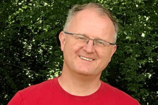 Professor Stefan Bleeck stands outside and smiles into the camera.