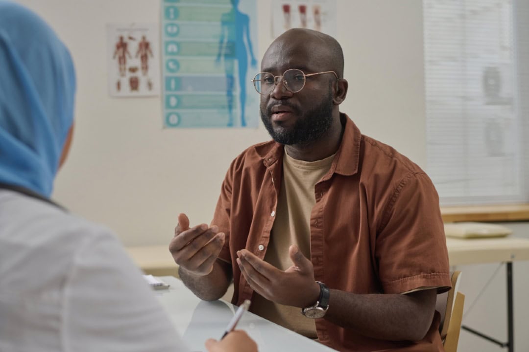 patient talking to their doctor in a hospital