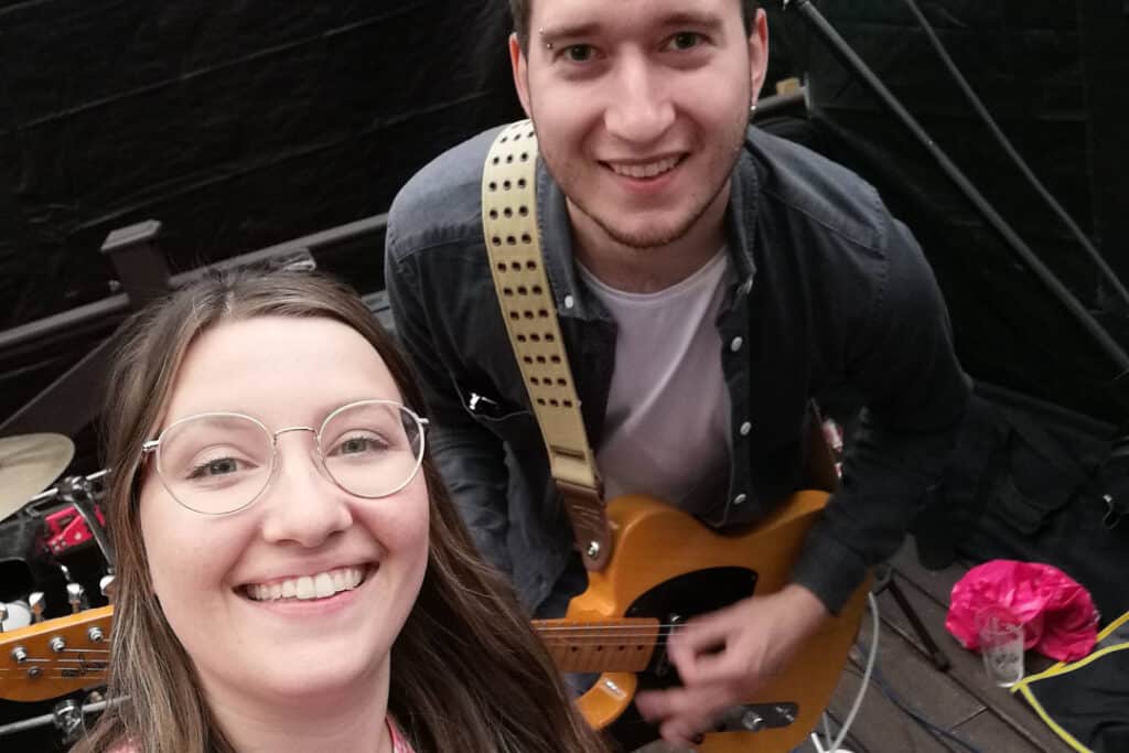 A selfie of RNID storyteller with her husband Joe who holds a guitar.