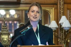 Celebrity Tasha Ghouri at the APPG event. She talks into a microphone.