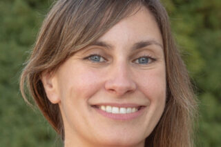 Research Dr Carmen Unzu has dark blonde hair and smiles.