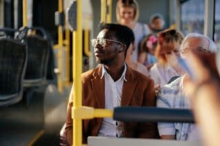 A man seated on a bus