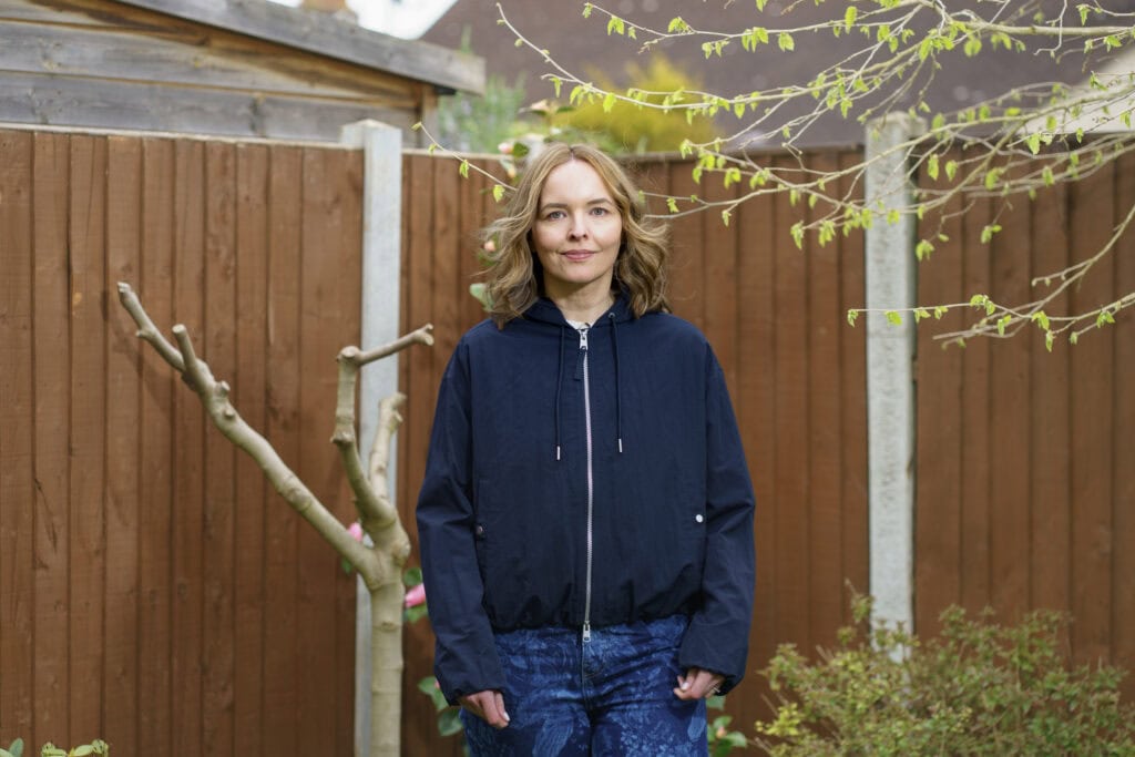 Storyteller Caroline standing in her garden 
