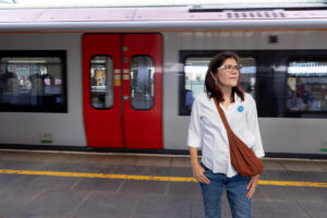 Storyteller Emily, stands on a station platform