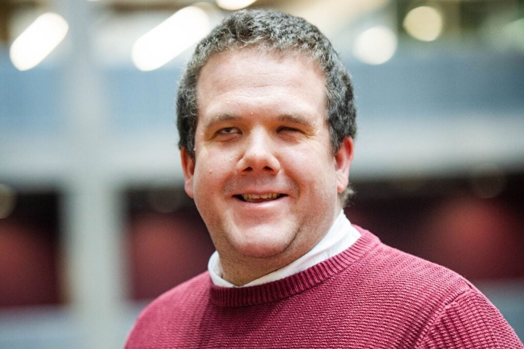 Robbie Crow, Diversity, Inclusion & Belonging Lead at BBC smiles.